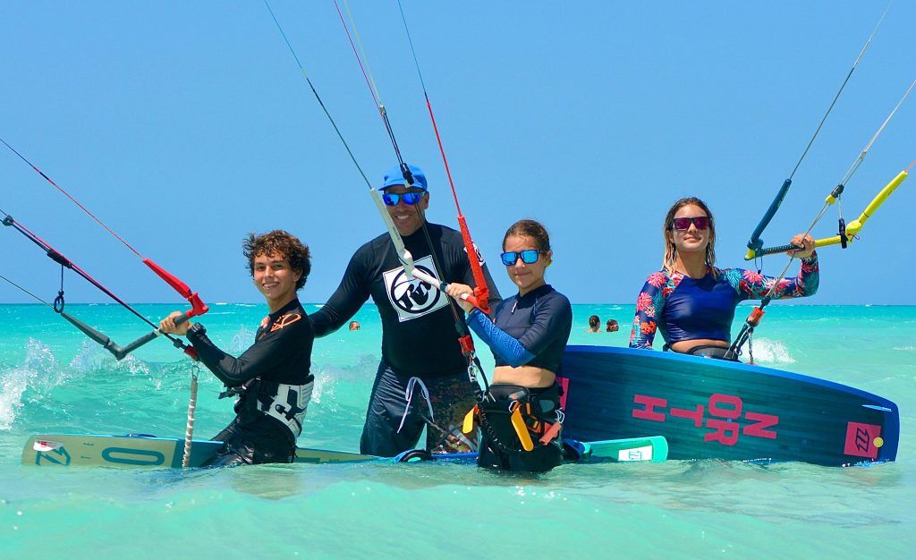 Caribbean Riders instructor and kiteboarding students with their kites in the shallow turquoise water of Varadero, Cuba
